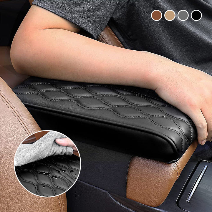 Driver resting arm comfortably on the black memory foam vehicle console cover
