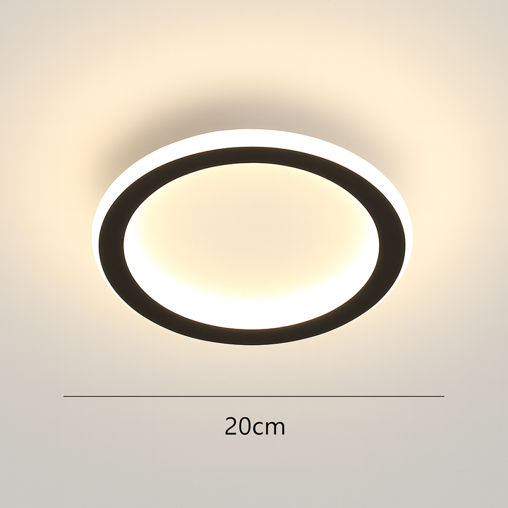 Round LED ceiling light fixture creating ambient illumination in a study
