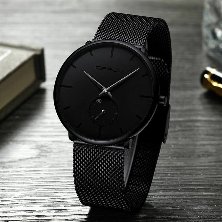 Mens minimalist luxury quartz watch featuring a sleek black dial