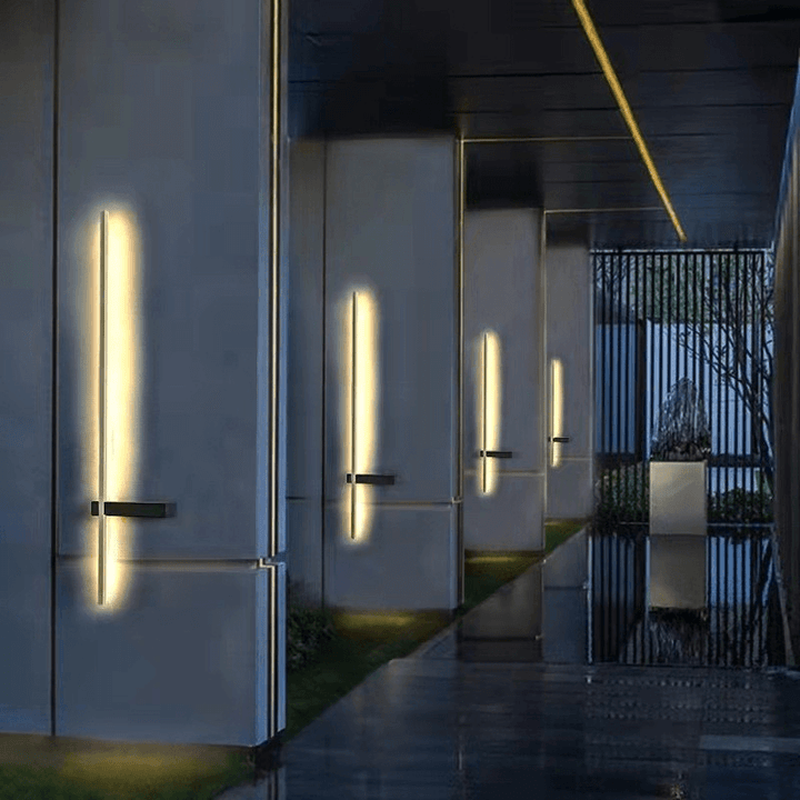 Durable waterproof exterior light fixture glowing brightly in a dark setting