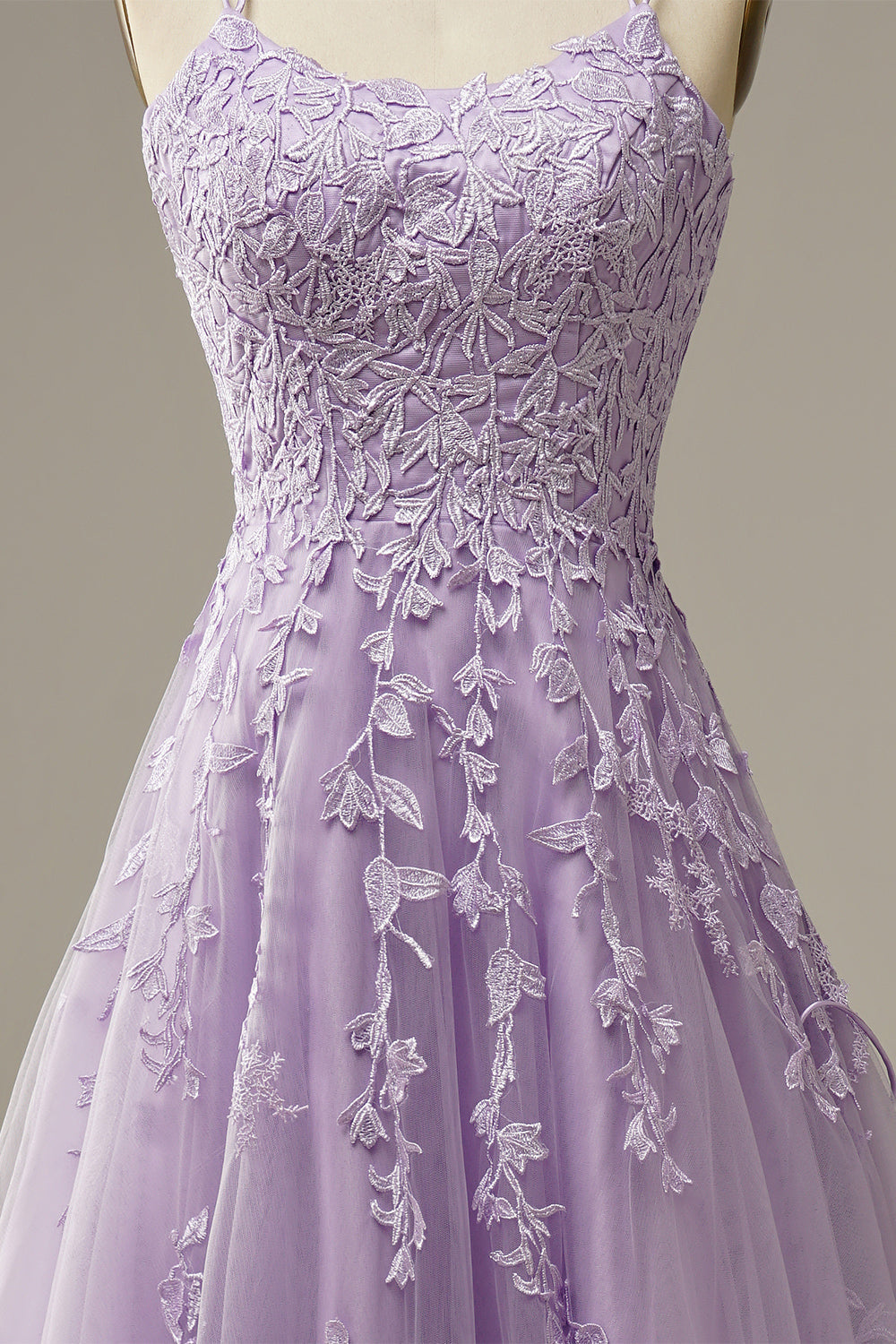 Close-up fabric detail of the layered tulle evening gown and bodice