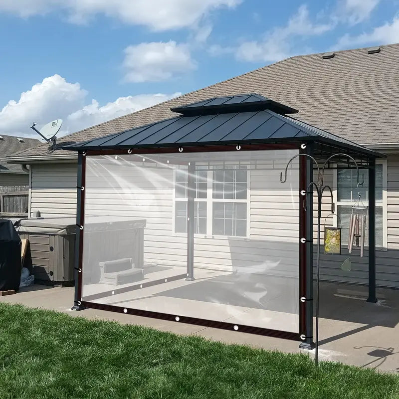 Heavy duty waterproof clear tarp cover installed on a backyard gazebo