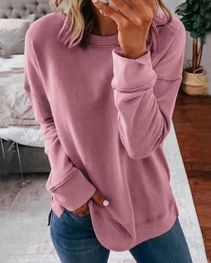 Woman wearing a pink classic long sleeve sweatshirt