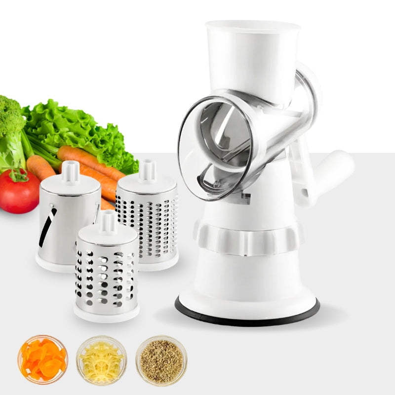 Manual white vegetable slicer with three interchangeable drum blades and fresh vegetables