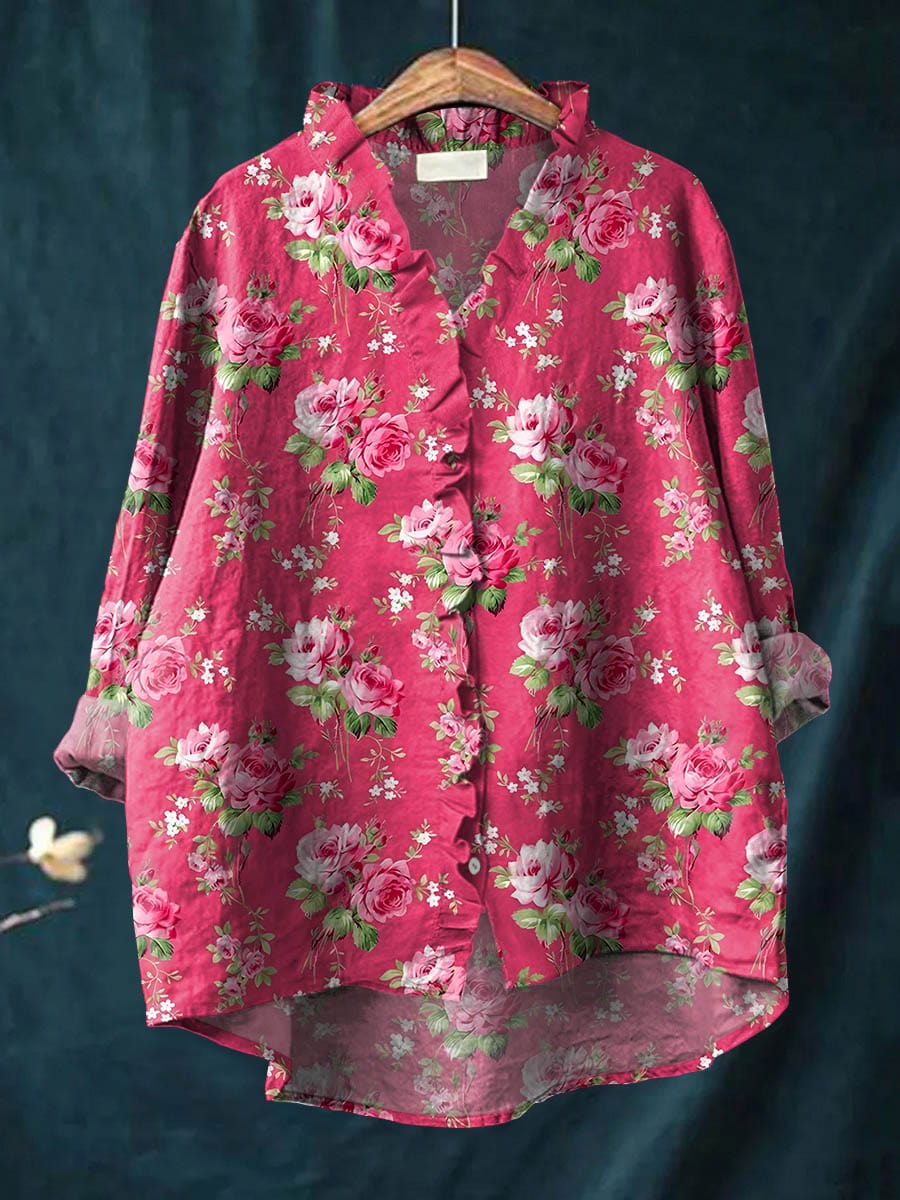 Pink floral blouse for women featuring long sleeves and button front design