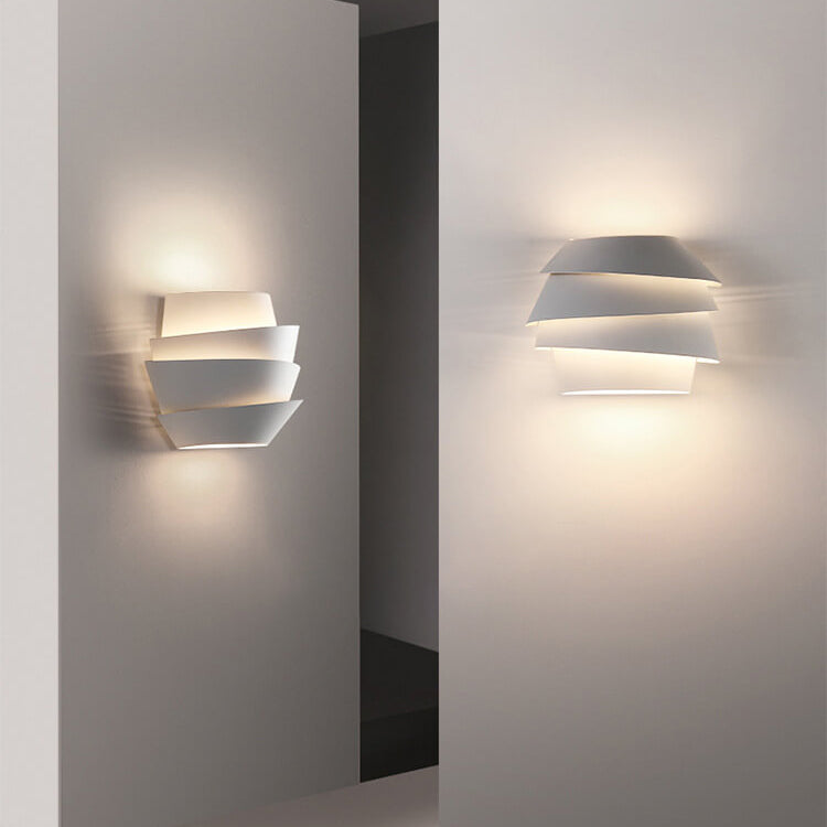 Perspective shot of the modern iron wall lamp installed in a corridor