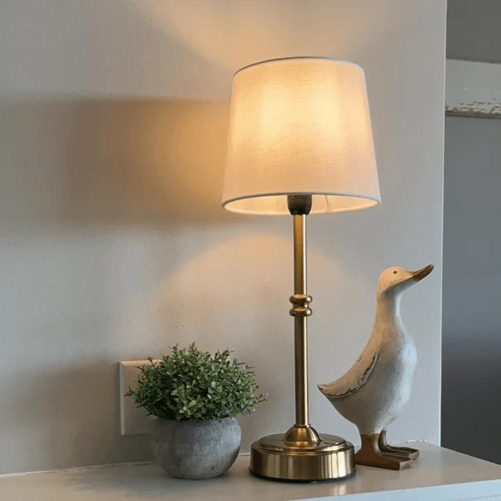 Close up of the touch control feature on the portable cordless table lamp