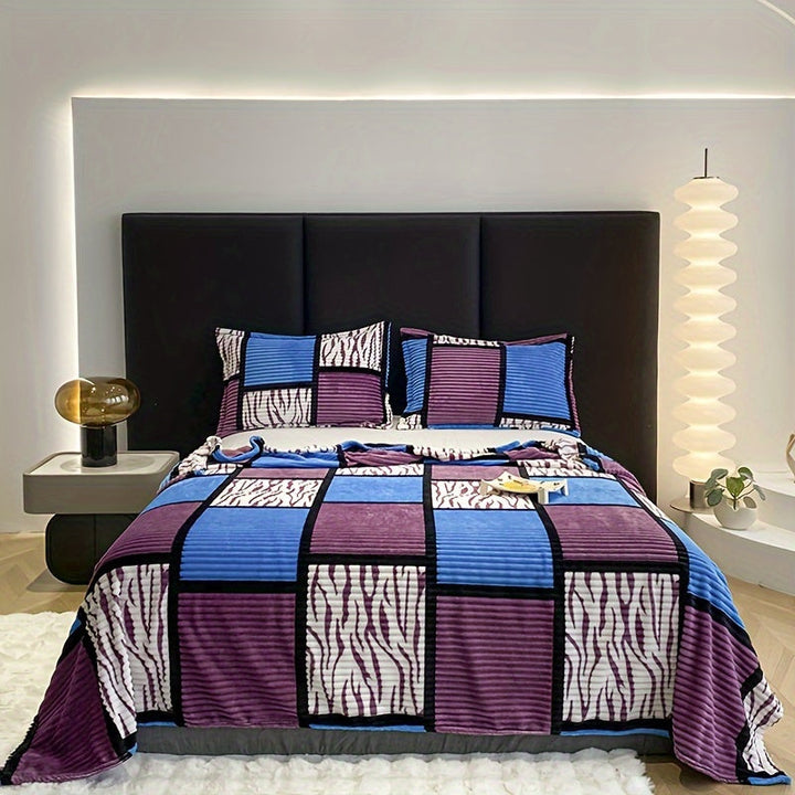 Decorative bedding accessory with a stylish flannel fleece blanket spread out