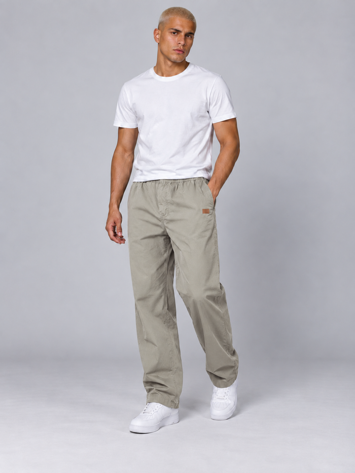 Side view of lightweight men's hiking trousers showing ergonomic outdoor pants design