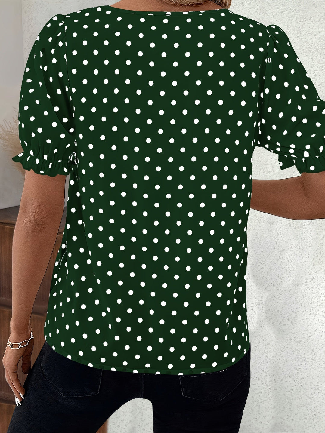 Women's blouse showing detailed textured fabric and cuffs