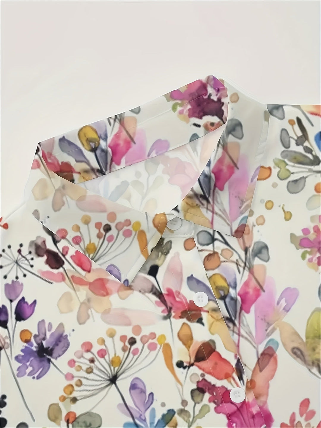 Close-up of the collar and button details on the floral shirt