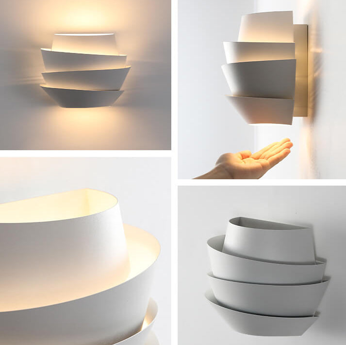 Accent light iron wall lamp casting warm glow upward and downward on a wall