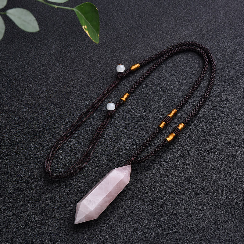 Energy healing crystal pendant necklace styled on a minimalist bust