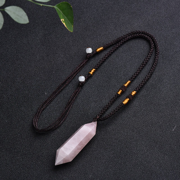 Energy healing crystal pendant necklace styled on a minimalist bust