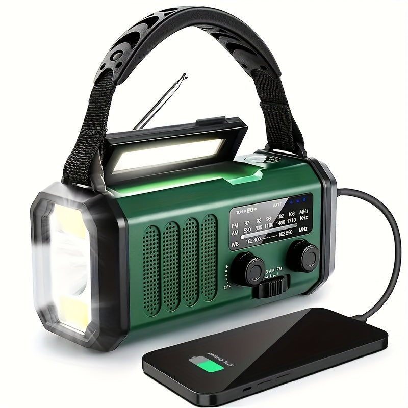 Multifunctional green emergency radio charging a smartphone via USB cable