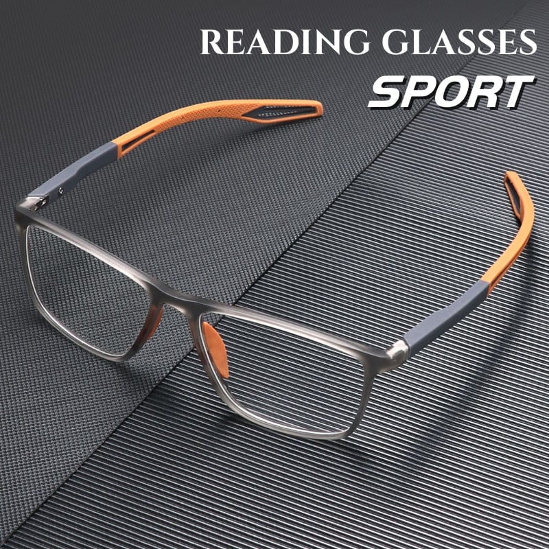 Orange and grey sport reading glasses resting on a textured dark surface