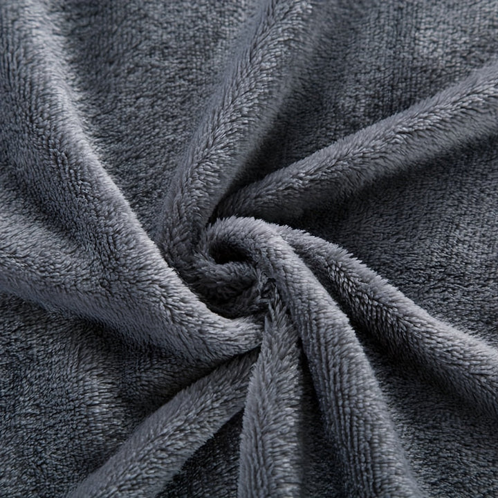 Plush flannel throw blanket highlighting fine stitching and durable quality
