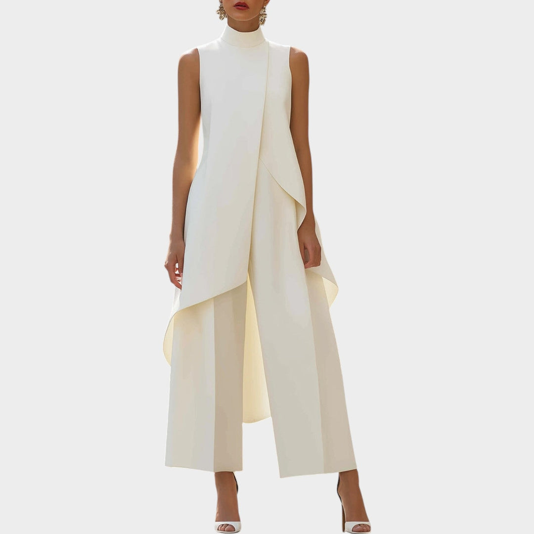Front view of a woman wearing a white sleeveless formal wide-leg jumpsuit with an asymmetric overlay.