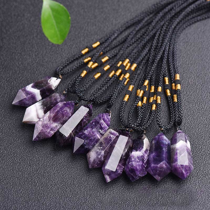 Natural gemstone healing crystal pendant necklace on a clean white background