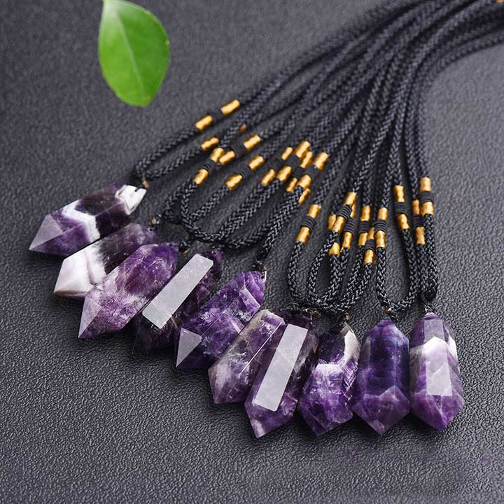 Natural gemstone healing crystal pendant necklace on a clean white background