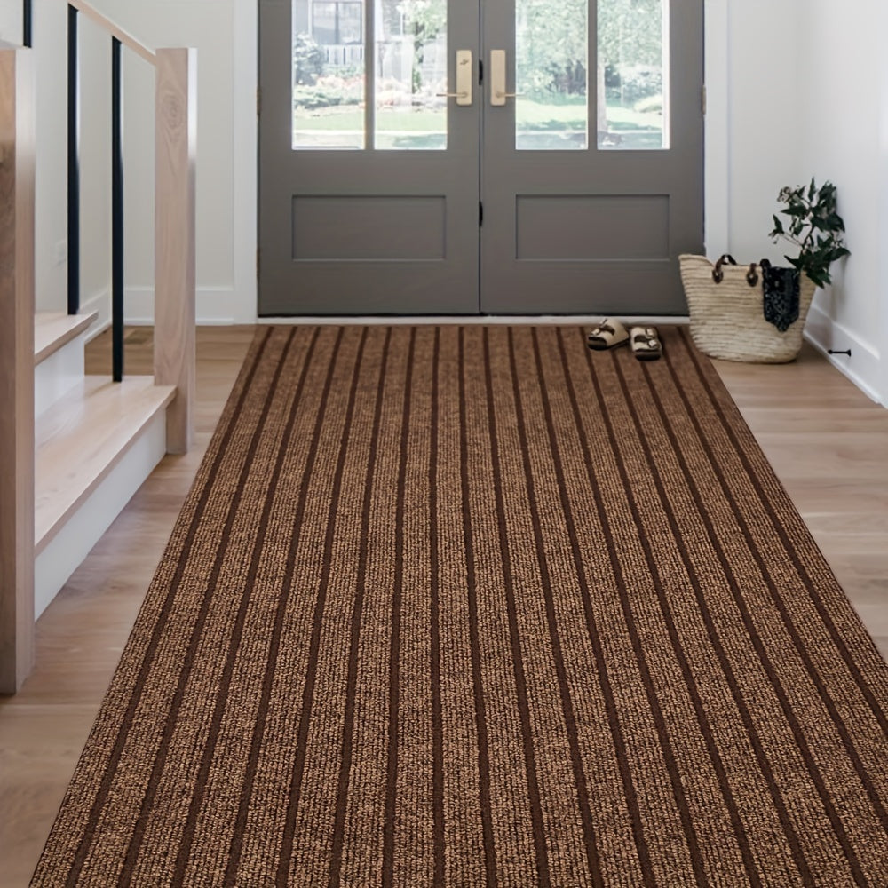Brown striped runner rug placed in a bright entryway with double doors.