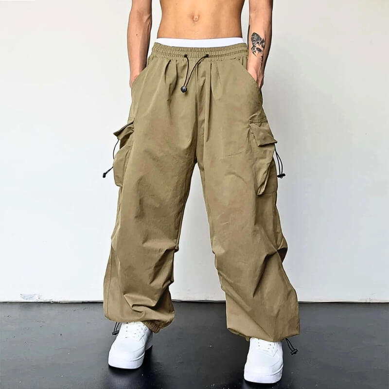 Unisex relaxed fit cargo joggers in khaki worn with white sneakers