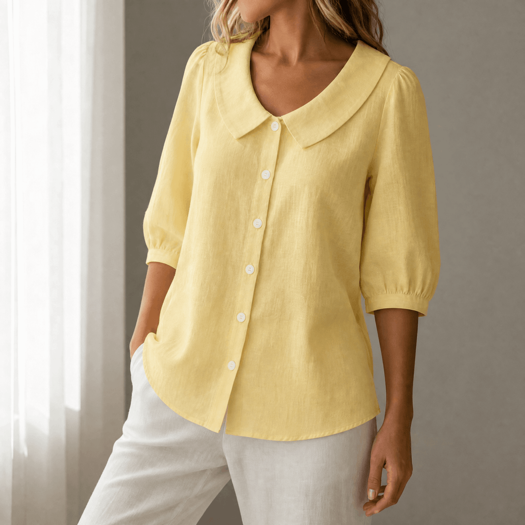 Flat lay of retro Peter Pan collar button-up blouse