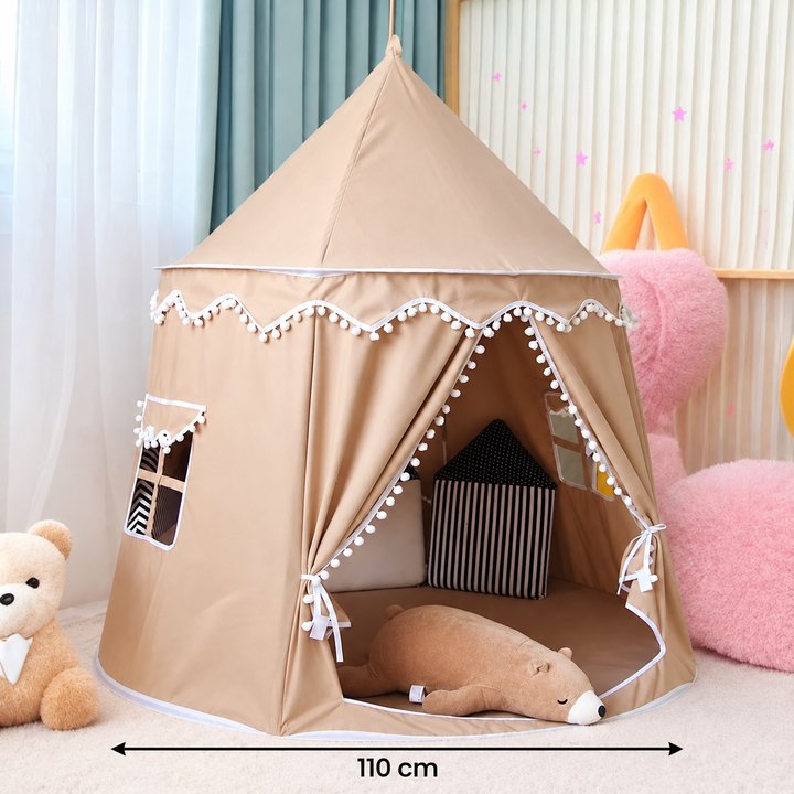 Pink and beige kids play tent castle set up as a cozy indoor reading nook with pillows