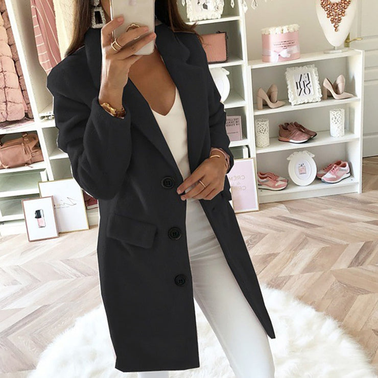 Woman wearing a classic black winter coat with lapels