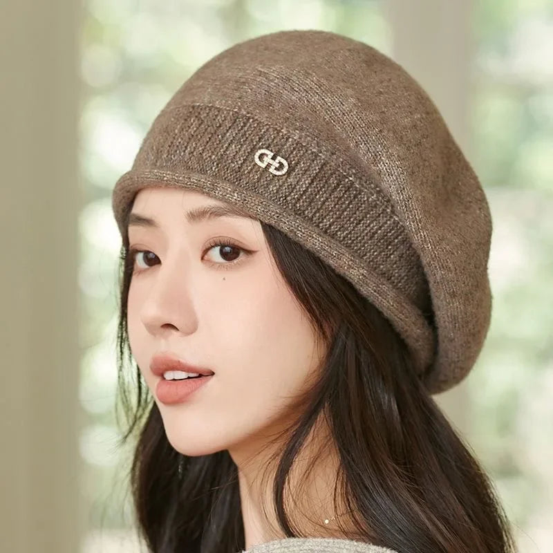 Stylish womens winter hat knit beret shown from the top showcasing classic Parisian shape