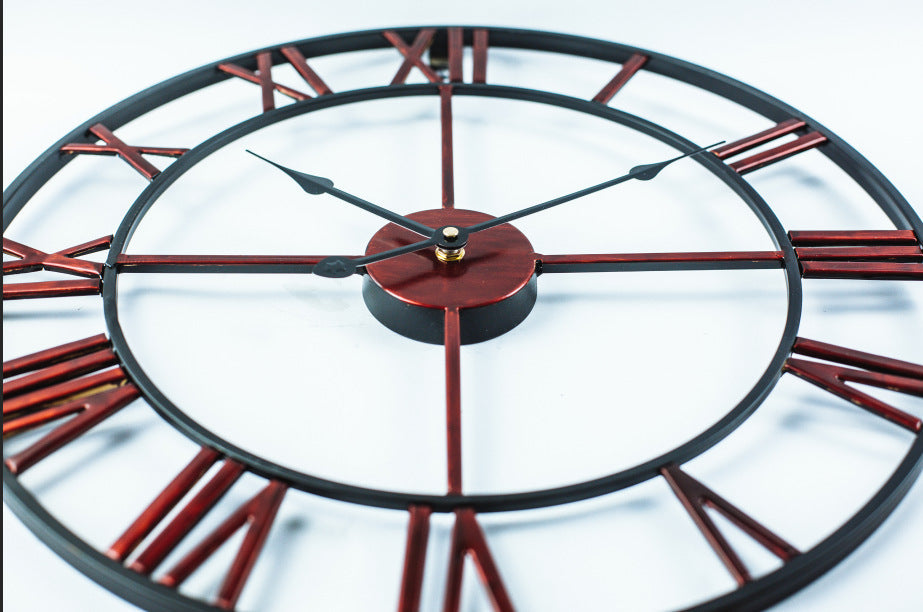 Close-up view of the roman numerals and metal finish on the clock