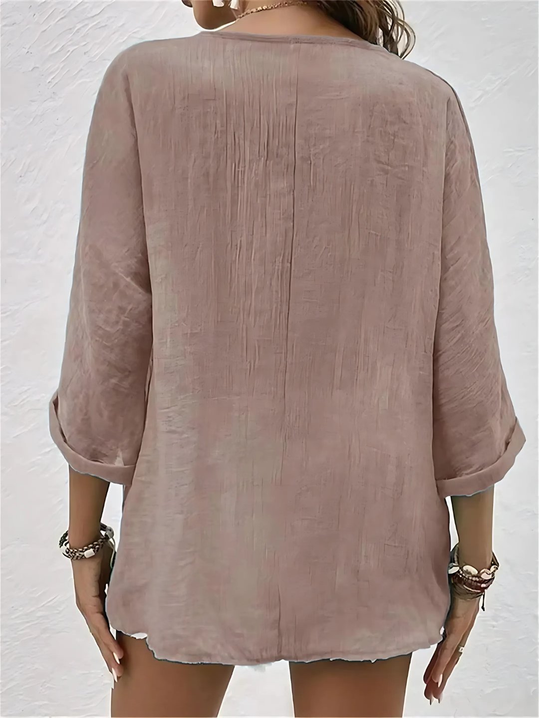 Flat lay of womens summer breezy day V-neck blouse