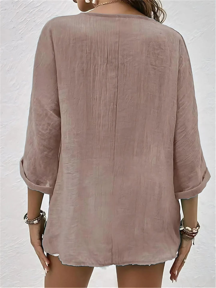 Flat lay of womens summer breezy day V-neck blouse