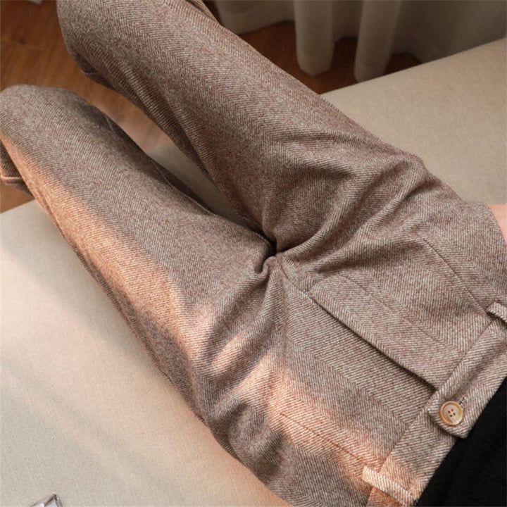 Fabric texture closeup of premium beige mens trousers for spring style