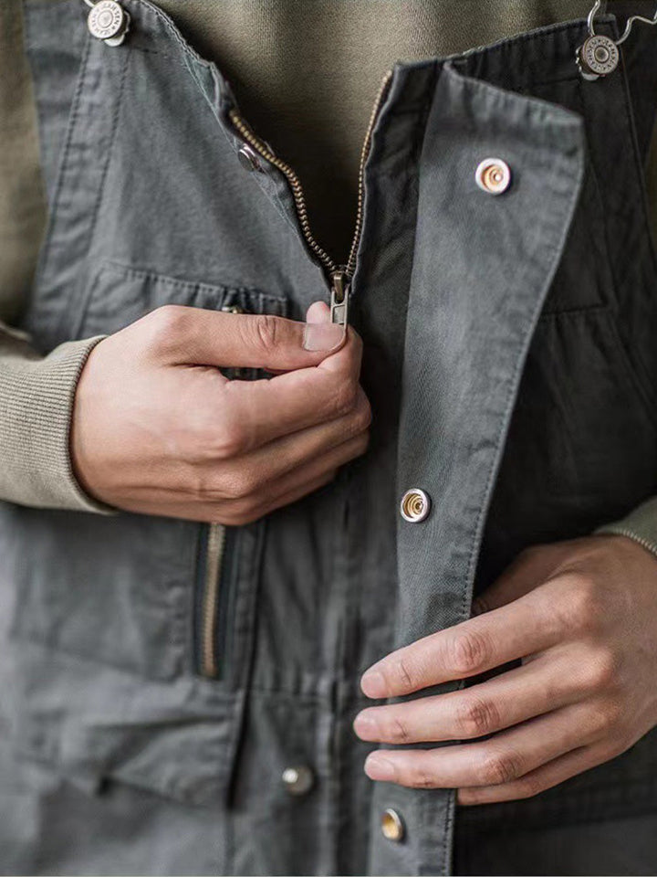 Detailed view of front zipper fly and button closure on workwear