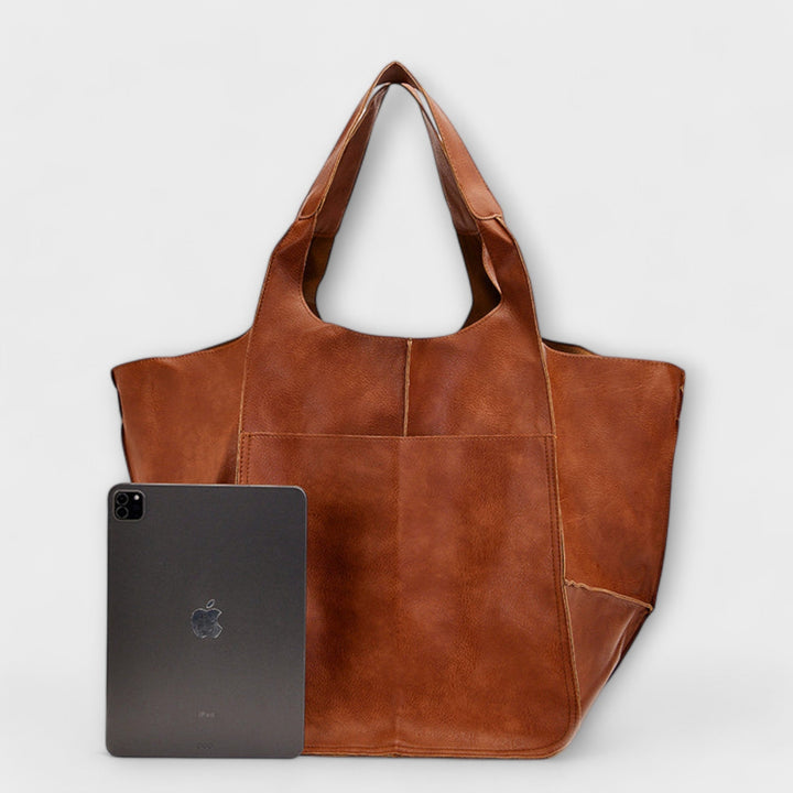 Casual tote bag for women showing durable shoulder straps and wide opening.