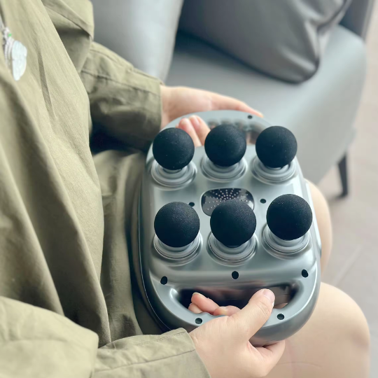 Detailed top view of the six massage heads on the device