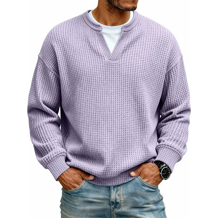 Man wearing a light purple waffle knit long sleeve t-shirt with a layered look