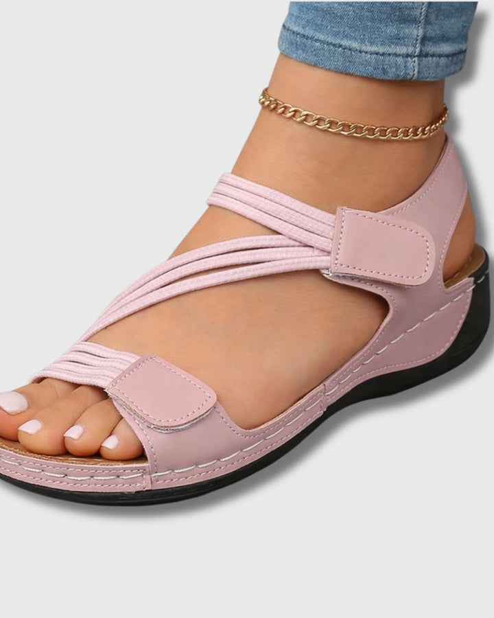 Side profile of womens casual comfort sandal showing arch support and adjustable straps.
