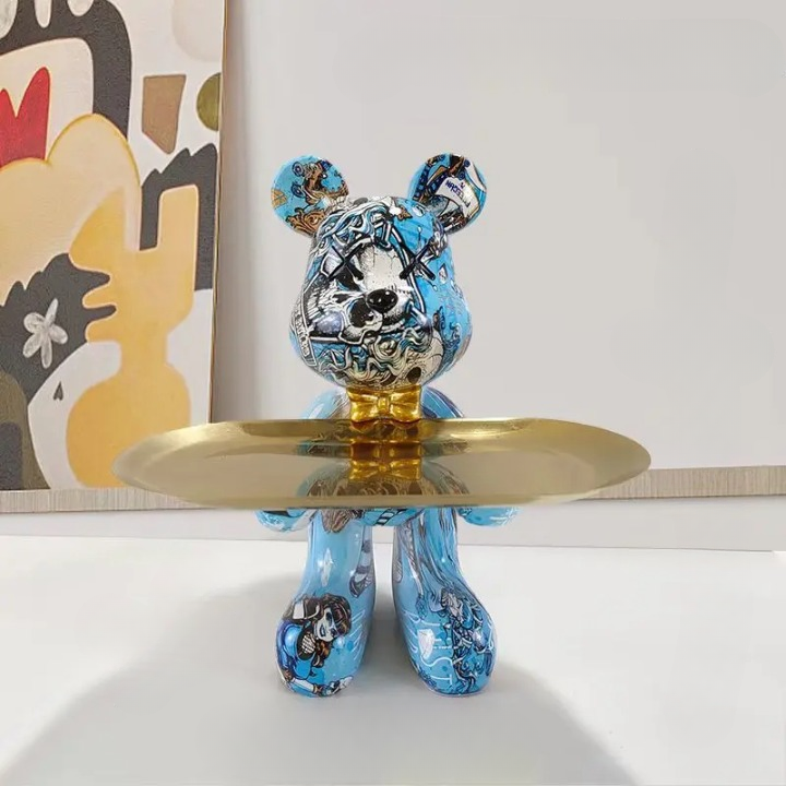 Blue patterned decorative bear sculpture featuring an integrated golden storage tray.