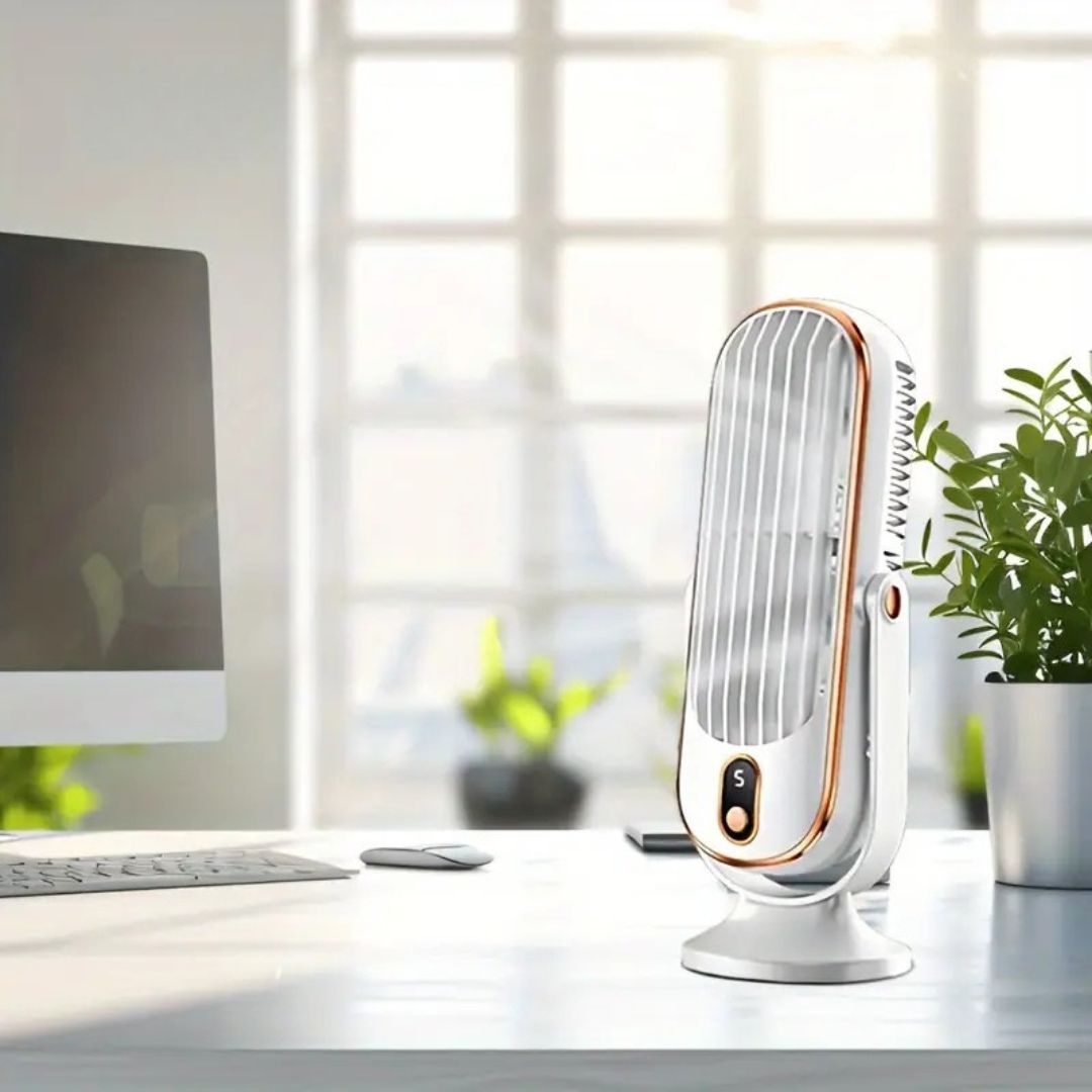 Portable quiet fan sitting on a modern wooden office desk next to stationery.