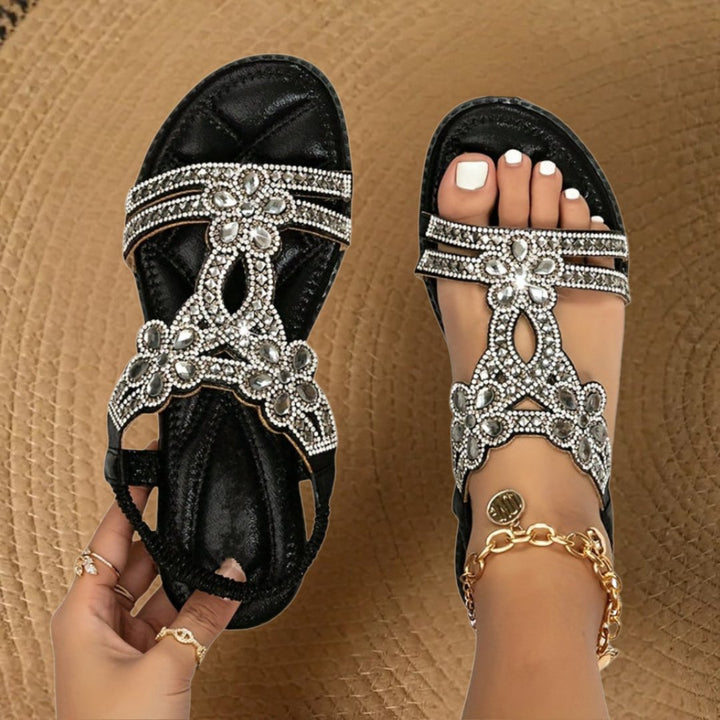 Back view of comfortable daily wear flat sandals with supportive arch design for women