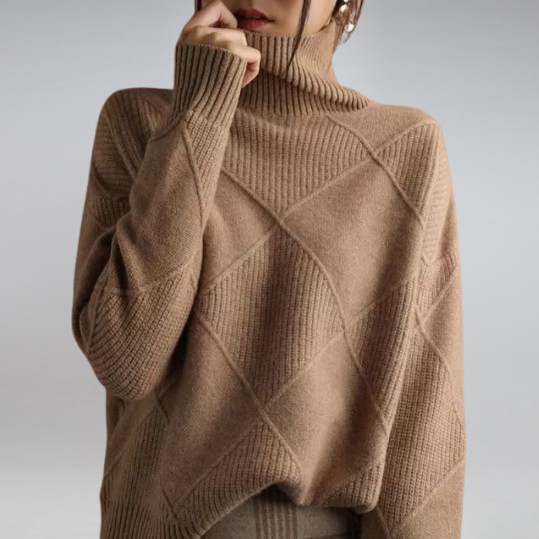 Woman wearing a brown turtleneck knit sweater with geometric pattern