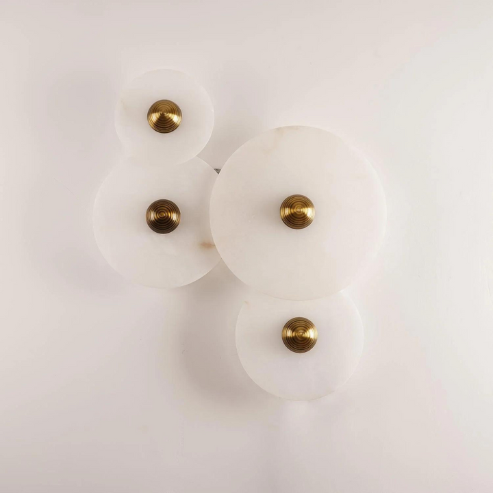 Detailed shot of the mounting bracket and sleek profile of the alabaster sconce