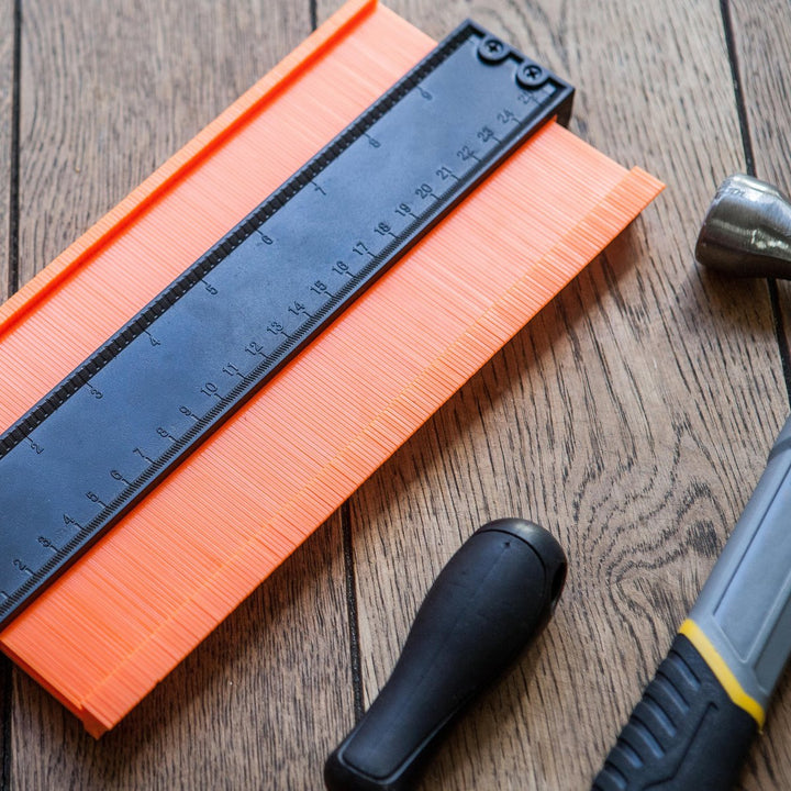 Profile gauge carpentry and tiling tool set showing pin mechanism for shape tracing