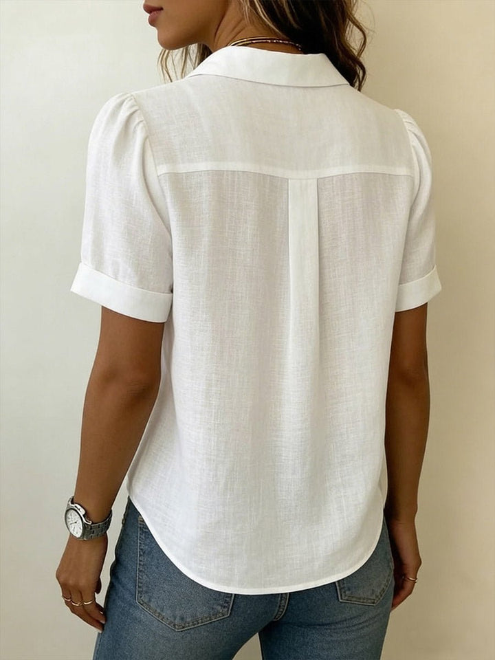Back view of women's short sleeve top showing tailored fit