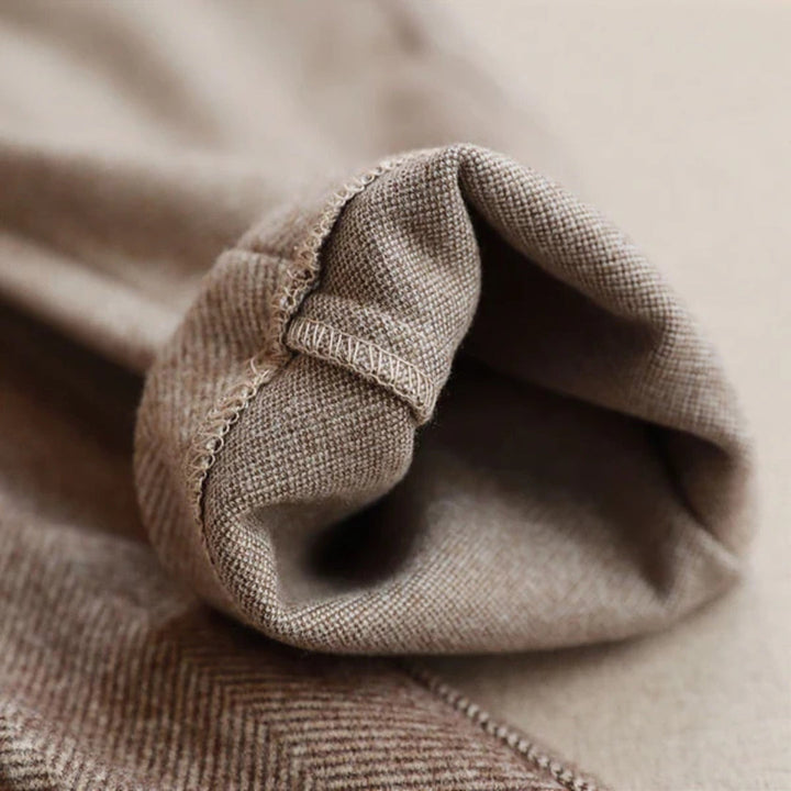 Close-up of waistband and button closure on beige smart casual mens pants