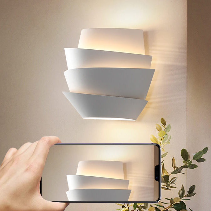 Modern wall lamp mounted vertically, displaying clean lines and iron finish