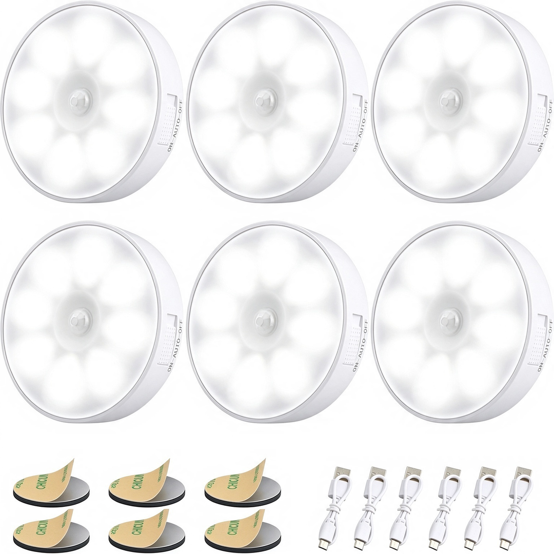 Six pack of white circular motion sensor lights with adhesive pads and USB cables