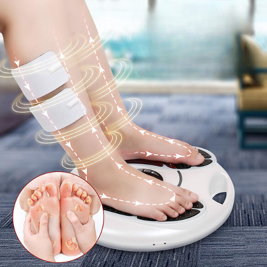 Close-up of electric foot massager pads in use on bare feet